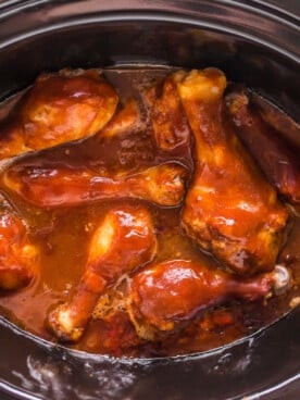 overhead shot of bbq drumsticks in crockpot.