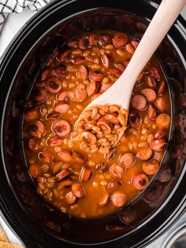 scooping out some slow cooker beanies and weenies.