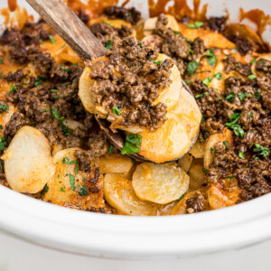 cooked beef and potatoes in a crockpot.