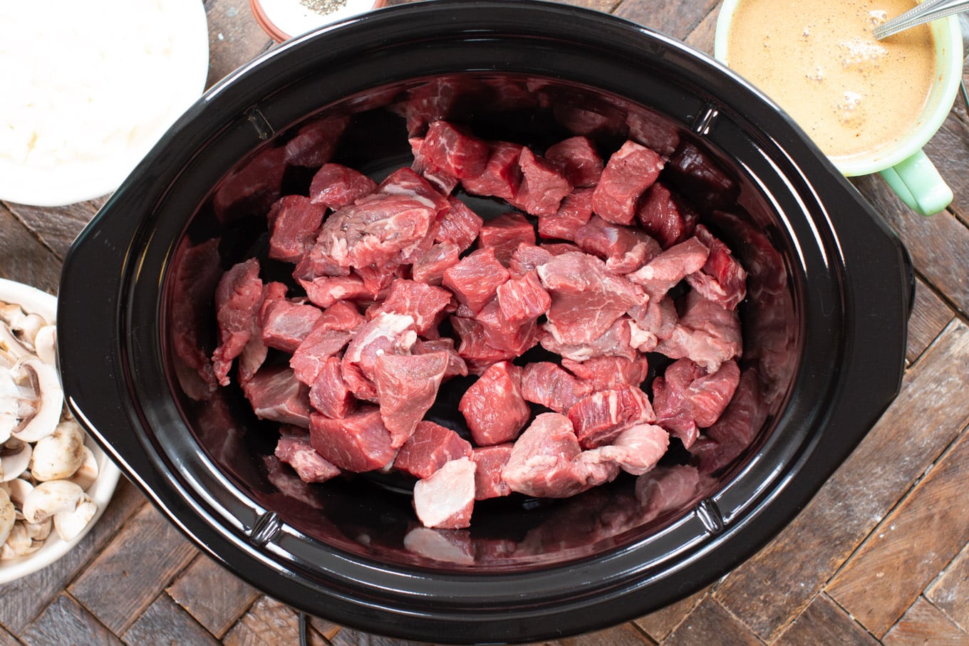 raw beef in a slow cooker.