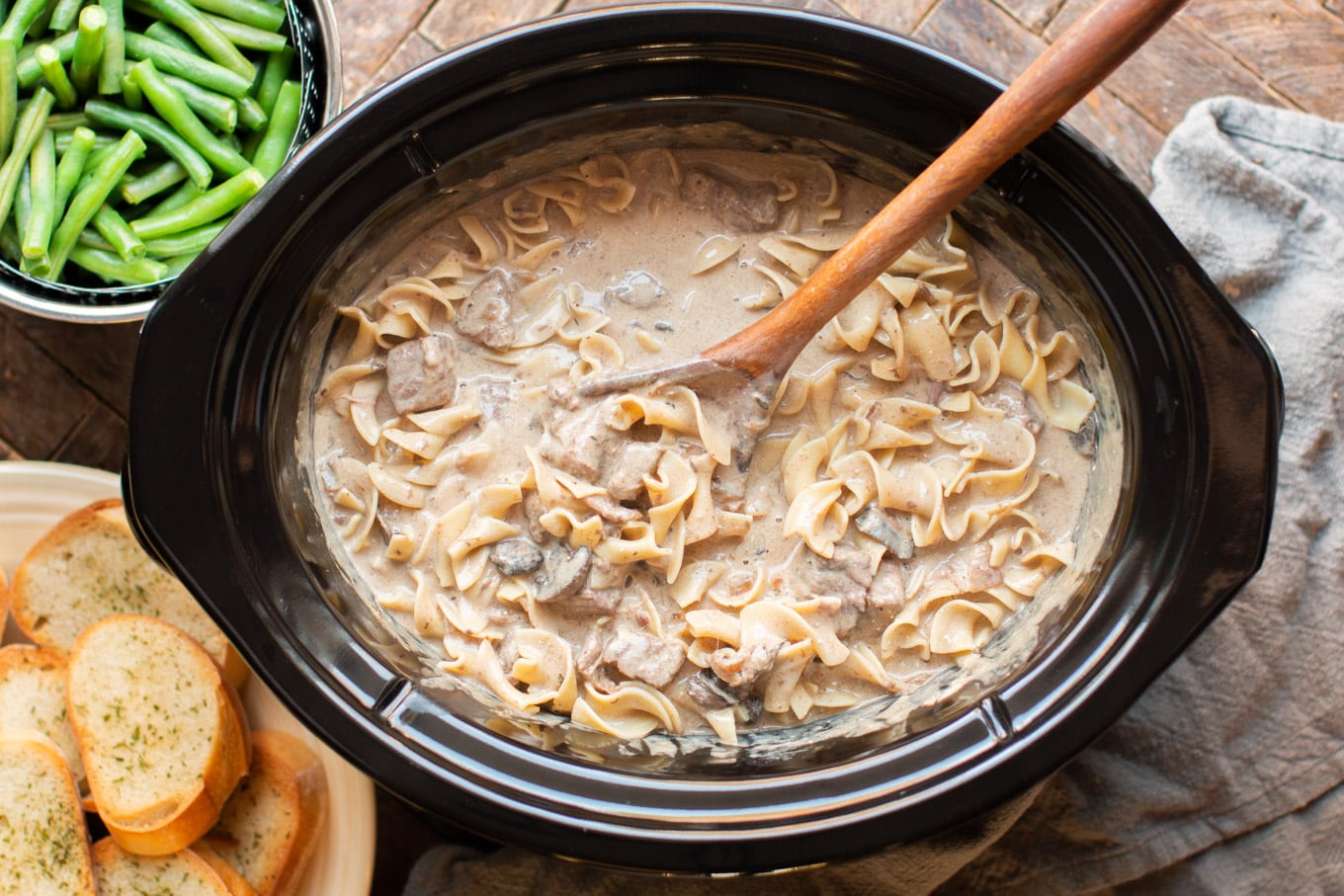 Beef stroganoff cooked with egg noodles in slow cooker.