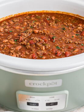 Chili in a green crockpot.