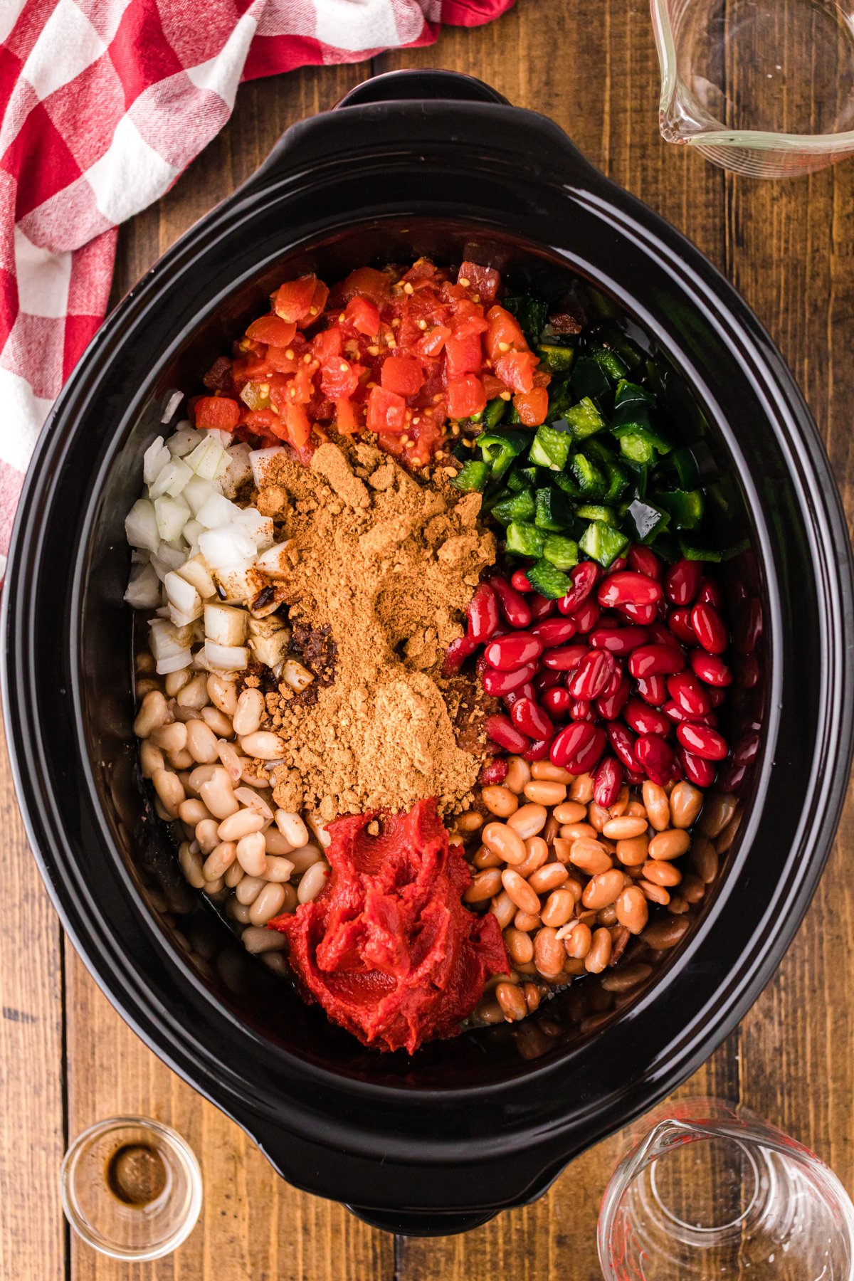 Ingredients for cowboy chili in a crockpot before cooking.