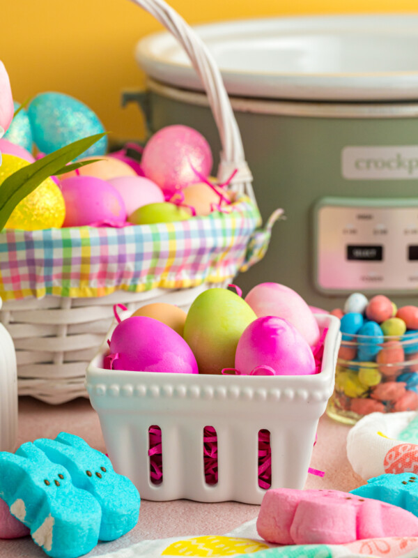 Slow cooker easter eggs in baskets on a table.