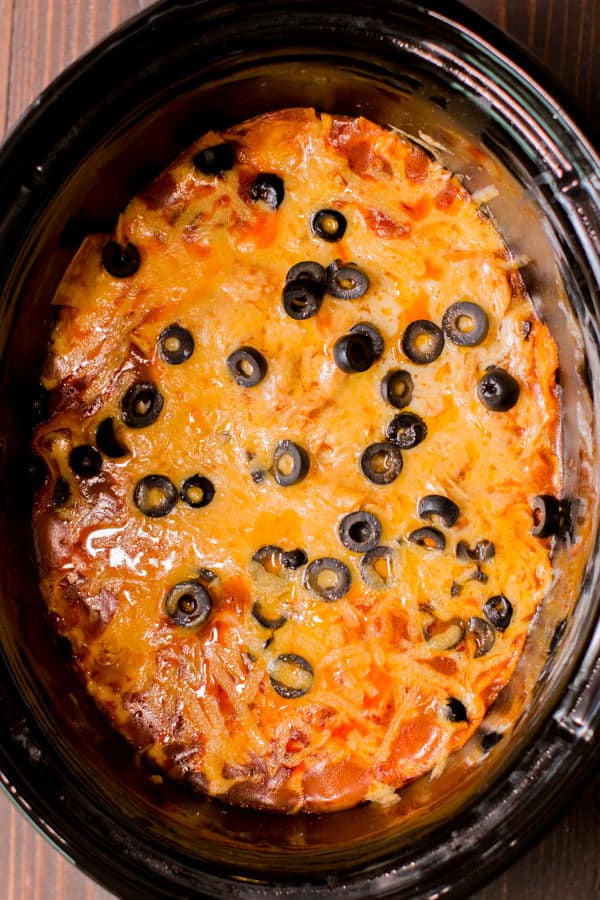 Slow Cooker Enchilada Casserole with olives on top