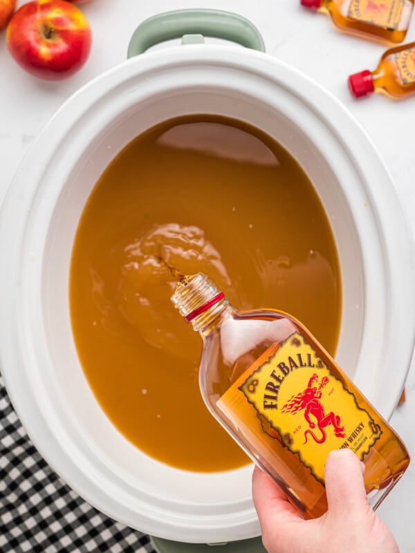 fireball being poured into apple cider.