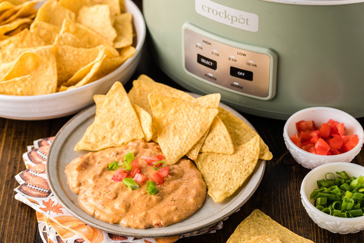 Football dip on a plate with tortilla chips.