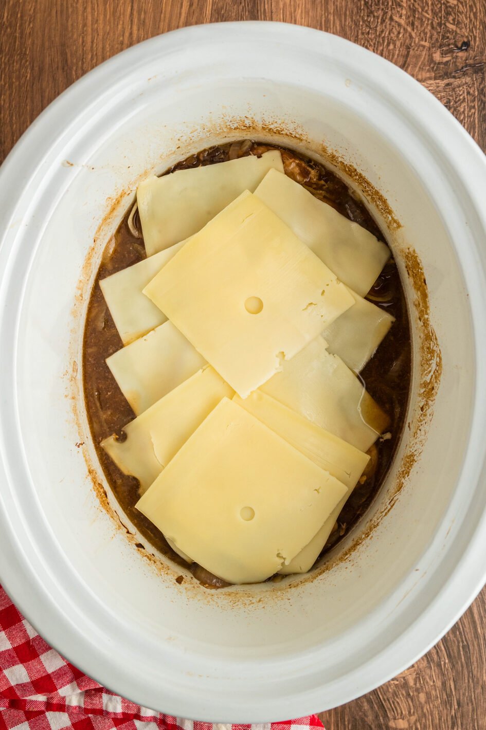 Swiss cheese on top of the chicken.