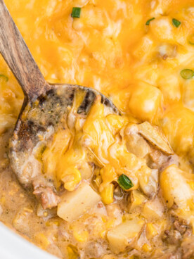 cooked hamburger hash in a white slow cooker.