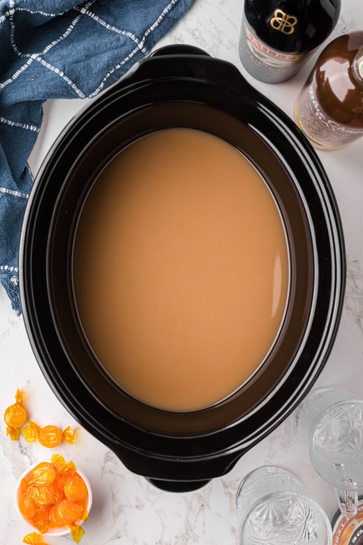 Slow cooker hot buttered rum coffee after cooking.