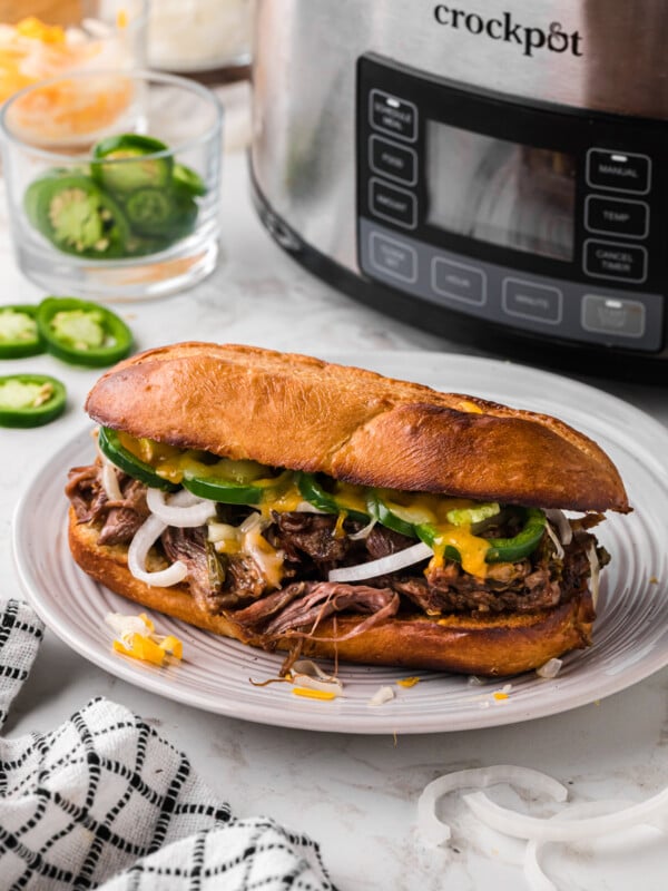 One of the slow cooker jalapeno beef sammies on a plate.