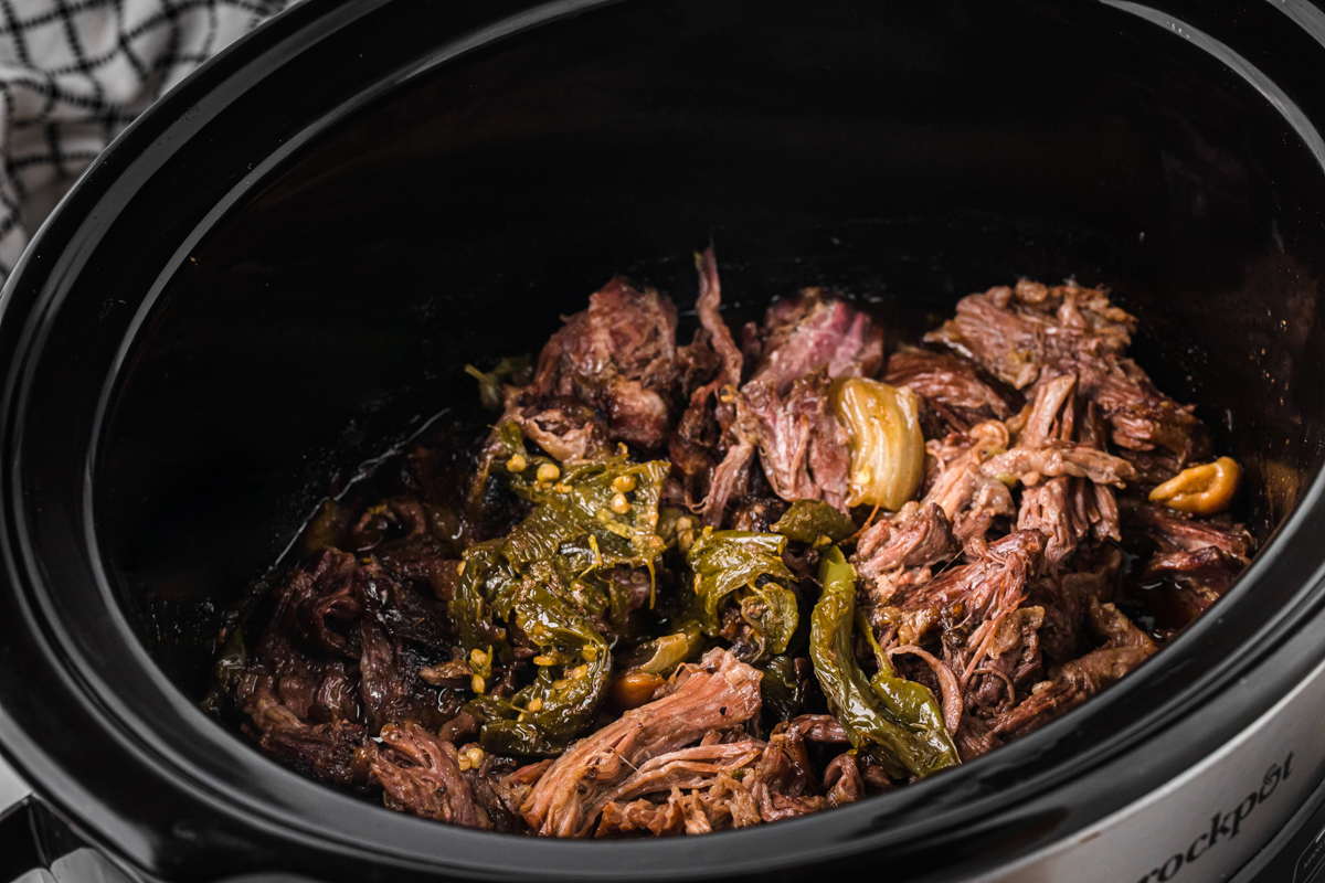 Meat for slow cooker jalapeno beef sammies in a crockpot.