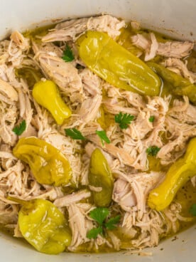 overhead shot of mississippi chicken in a crockpot.