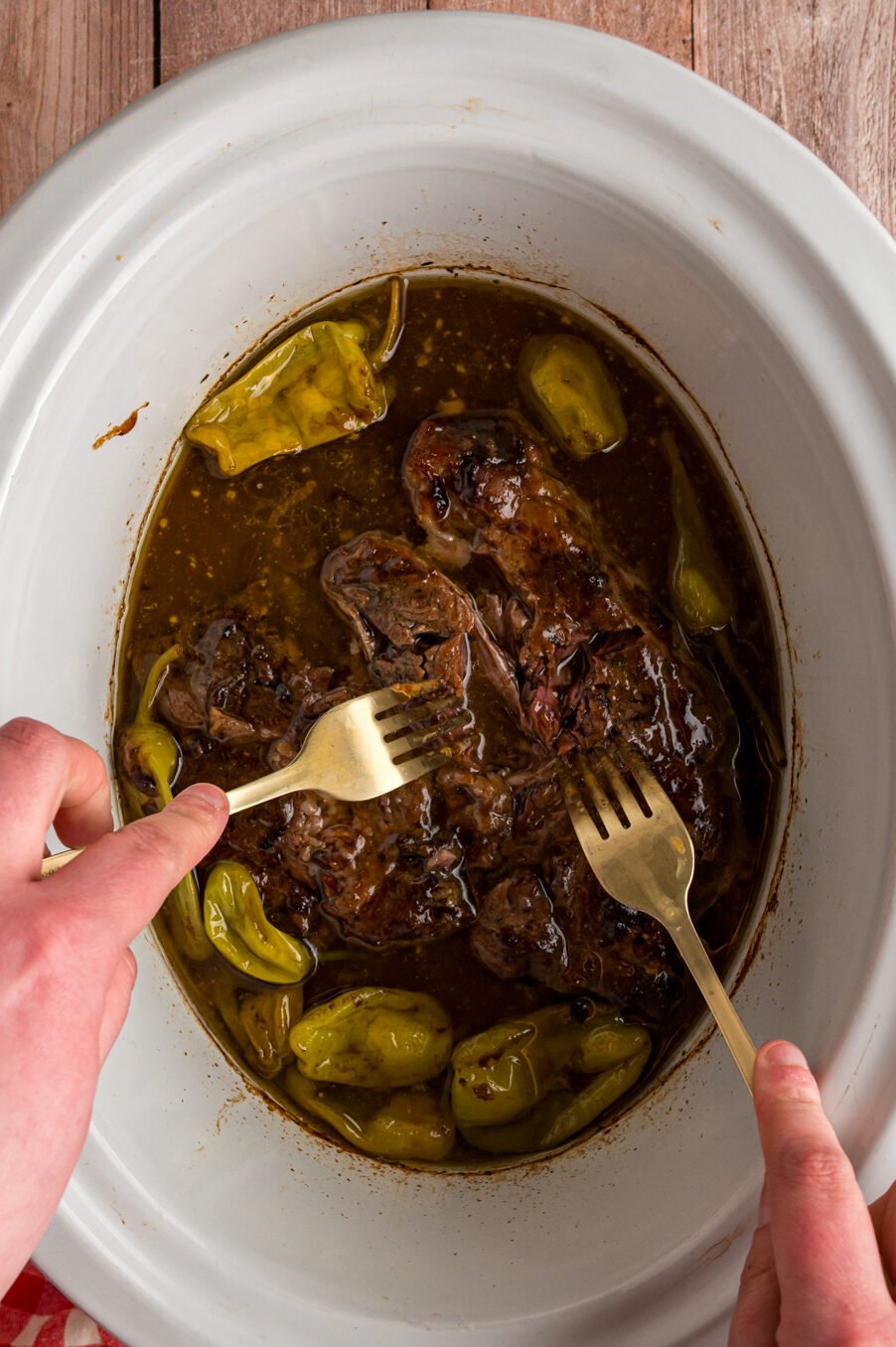 2 forks shredding mississippi pot roast.