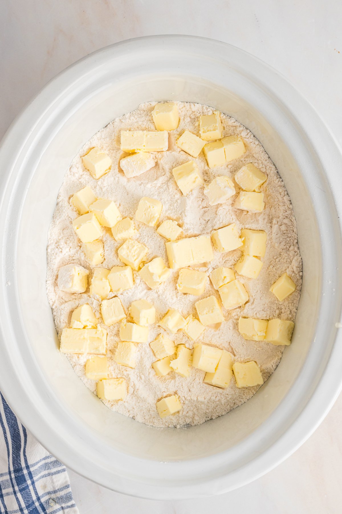 cake mix and butter on top of peaches.