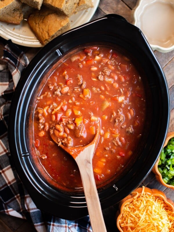 pumpkin chili with meat and beans. Cornbread, cheese and onions on the side.
