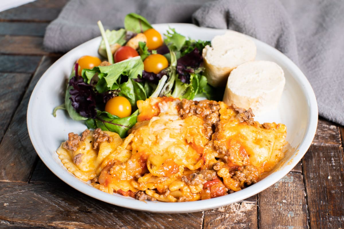 plate with ravioli and salad.
