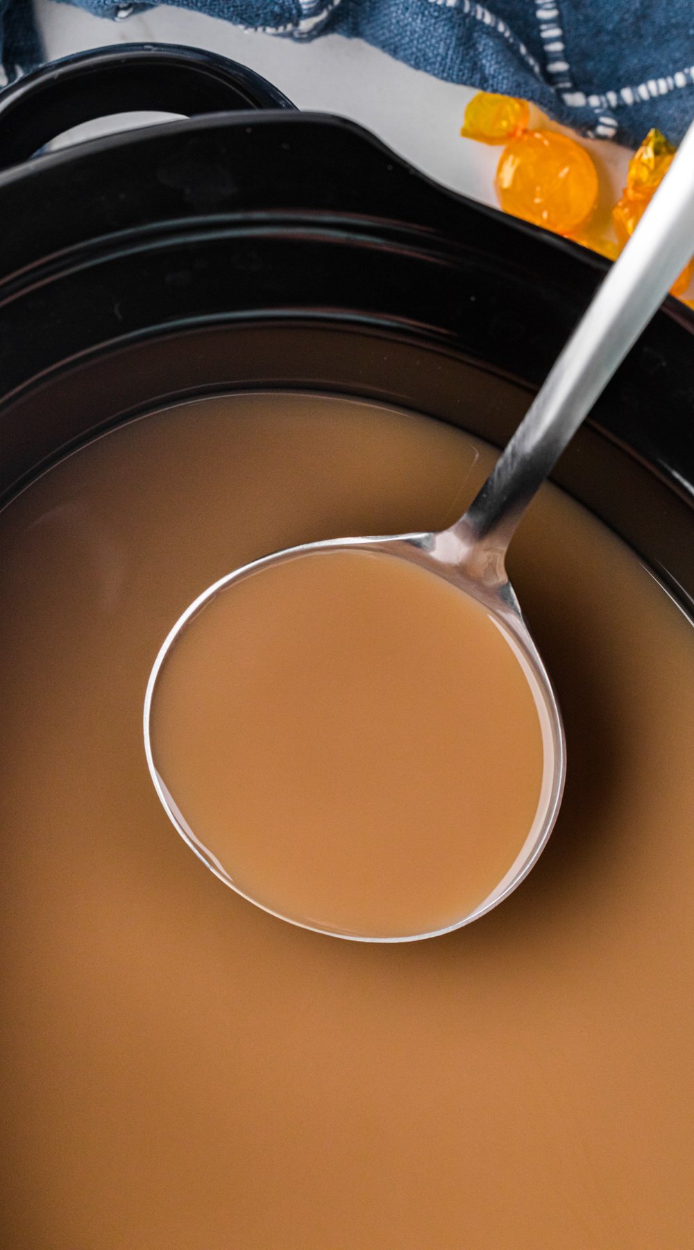 Long image of slow cooker hot buttered rum coffee.