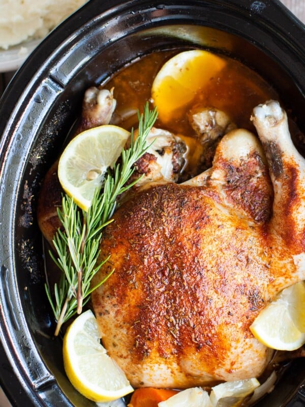 close up image of a whole chicken in it's juices.