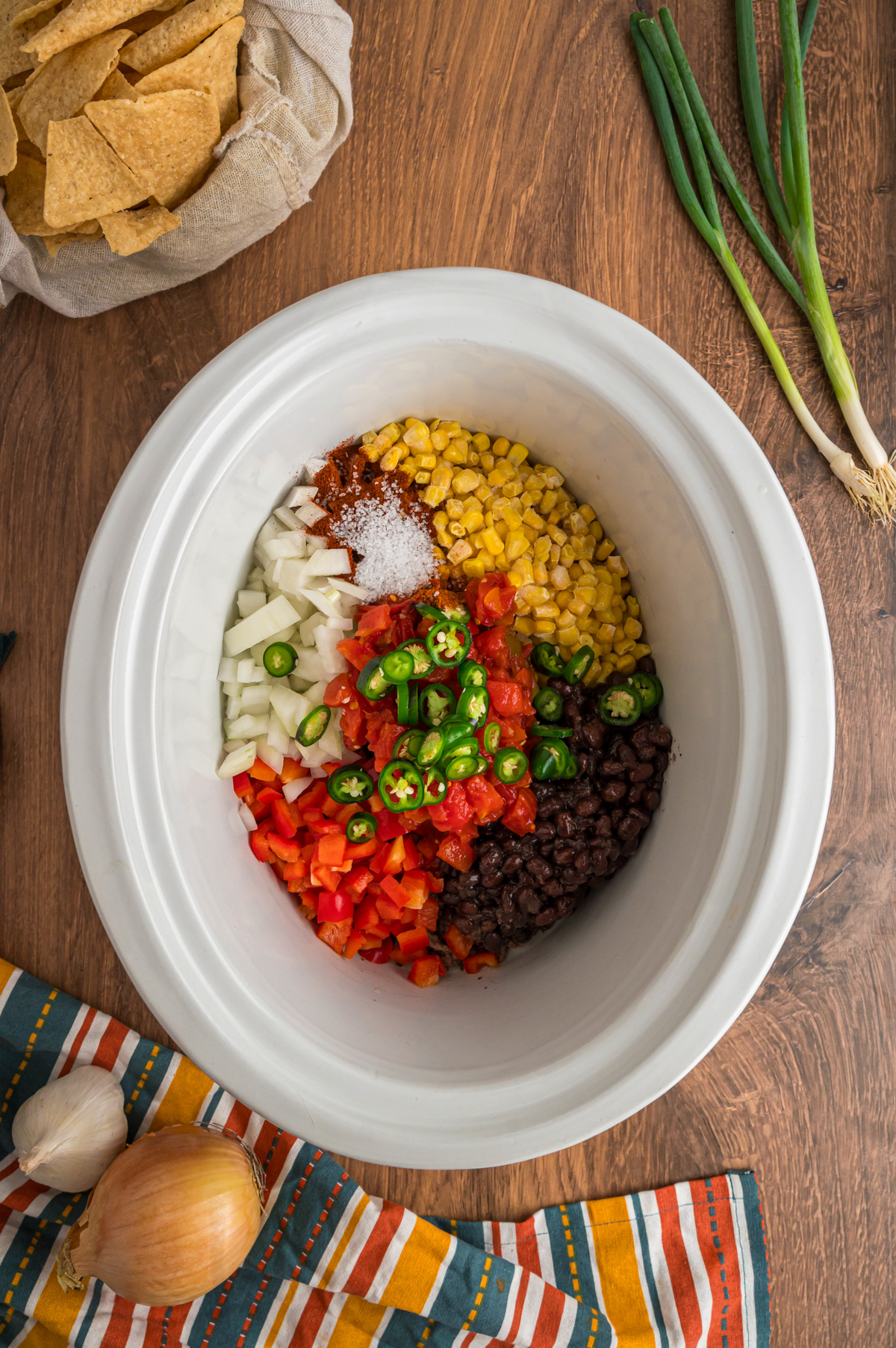 raw ingredients for nacho soup in a slow cooker.